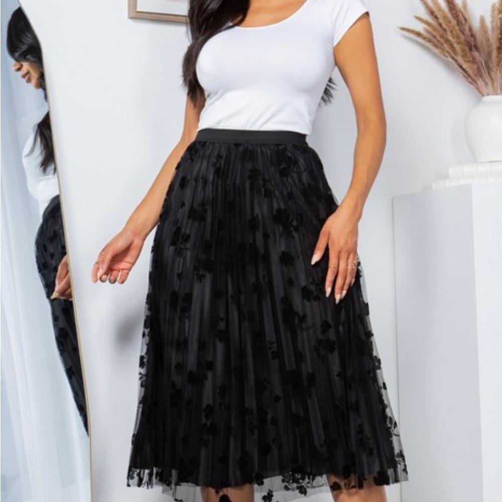 Black skirt with mesh outlayer
